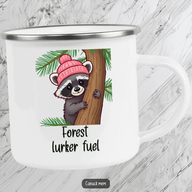 Funny Raccoon Hat Camping Mug: A curious raccoon wearing a tiny knitted hat peeks from behind a pine tree, ideal for outdoor use.