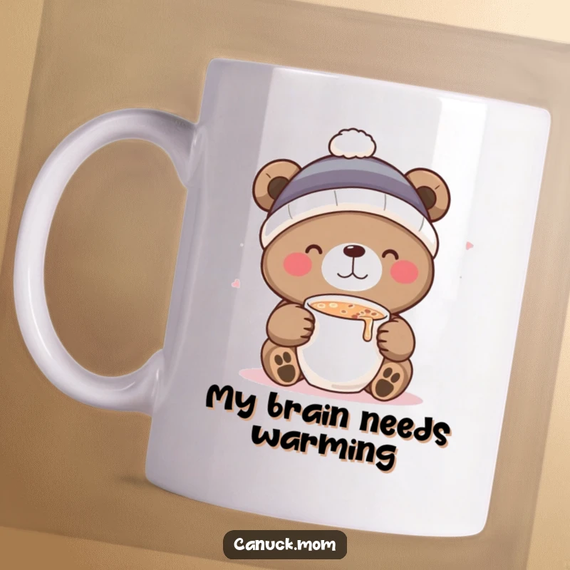 Funny mug with a cute bear in a toque delightedly sipping hot cocoa, embodying cozy winter joy and seasonal comfort.