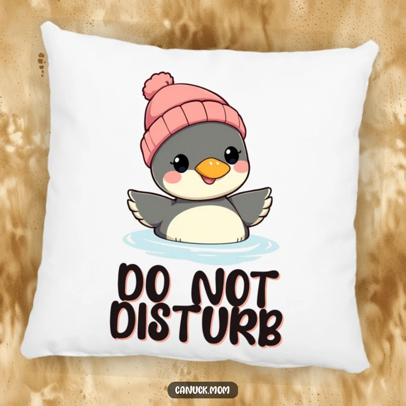 Funny Loon Beanie Pillow: A smiling loon in a knit beanie rests comfortably, offering soft comfort and a dose of whimsical humor.