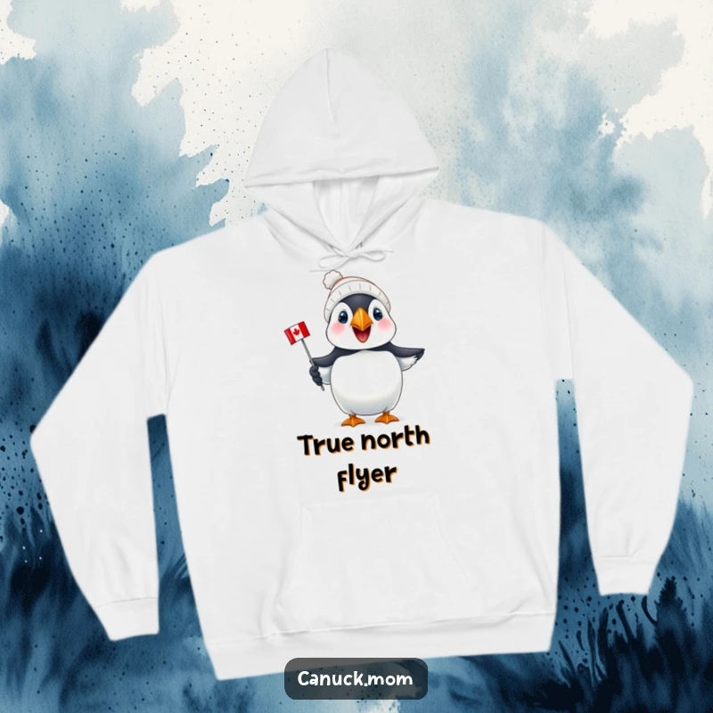 Funny Puffin Canada Hoodie: A joyful puffin wearing a tiny toque proudly holds a mini Canadian flag, perfect for chilly days.