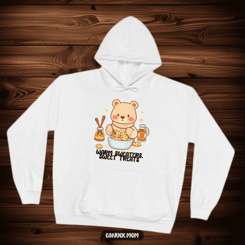 Funny bear wearing a cozy sweater, baking maple syrup cookies on a hoodie, offering ultimate comfort and charm.