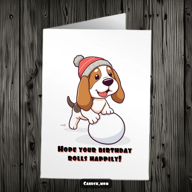 Free Printable Birthday Card: A Basset hound in a warm cap comically trips over a rolling snowball, a funny moment.