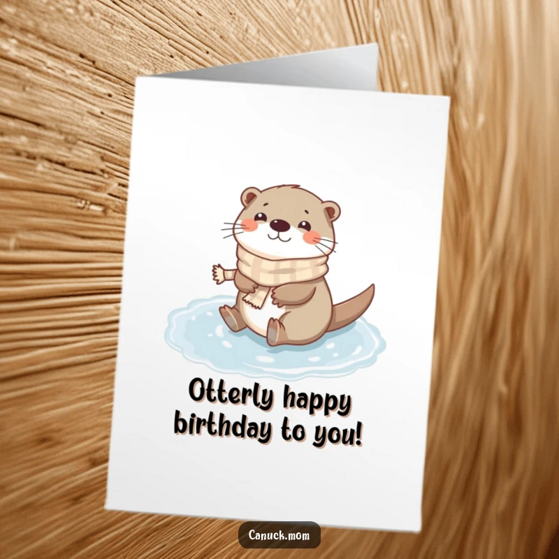 Funny Free Printable Birthday Card: A happy otter wearing a tiny scarf gleefully slides on a frozen puddle.