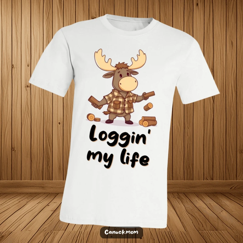 Funny Moose Lumberjack T-Shirt, featuring a bearded cartoon moose in a flannel shirt, energetically juggling tiny logs, a hilarious wearable.