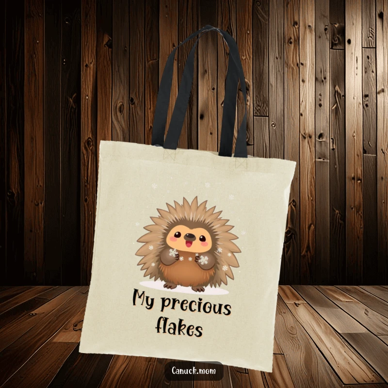 Funny proud porcupine holding tiny snowflakes on a durable tote bag for winter outings.